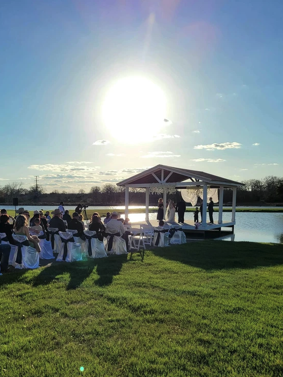 Sunset lakeside ceremony at Reverie at Diamond D, home of the Diamond D Journal wedding planning blog