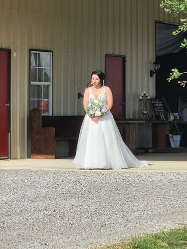 Bride on the covered porch at Reverie at Diamond D during a Texas bachelorette weekend near College Station
