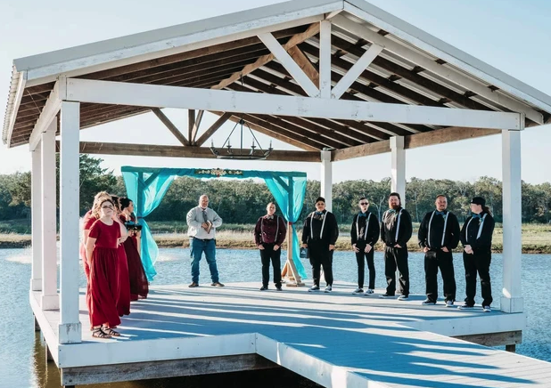 Guests gathered under the covered lakeside pavilion during a celebration in the Brazos Valley