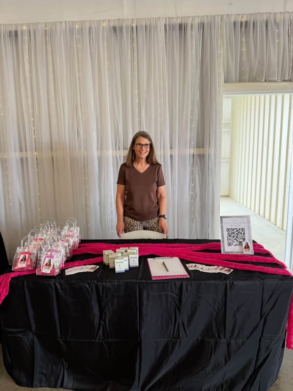 October 2026 Open House at Reverie at Diamond D wedding venue in Normangee, Texas — a vendor booth with guest gift bags and a scan-to-pay sign