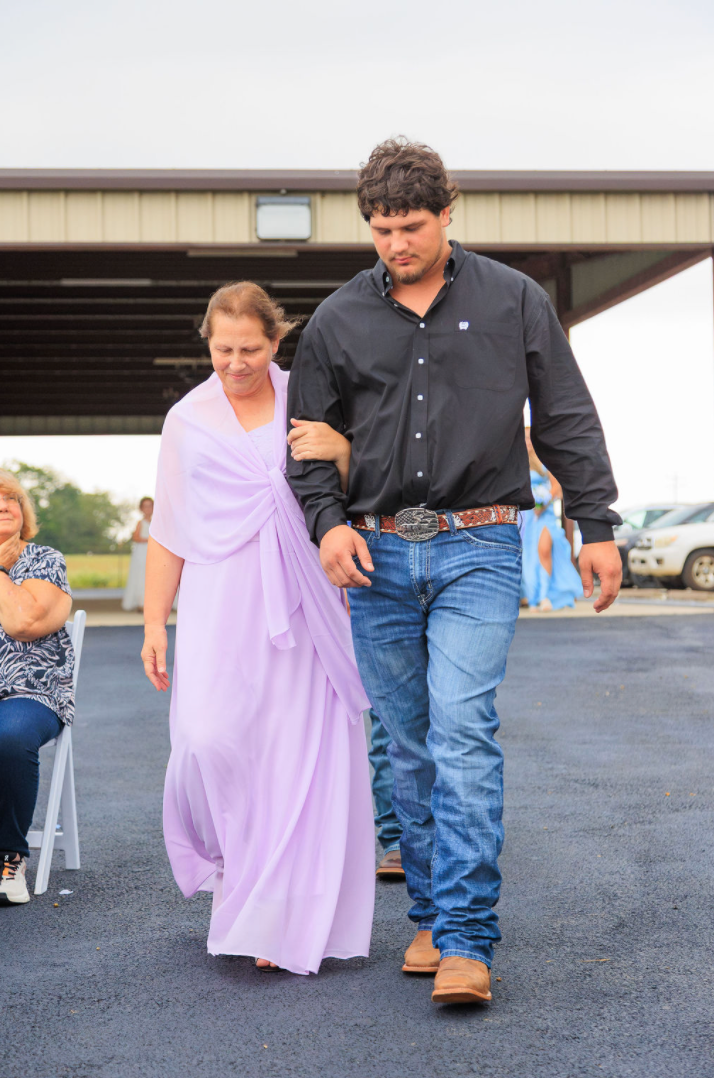 Jaelyn & Keelan's wedding at Reverie at Diamond D — the groom walking his mother down the aisle