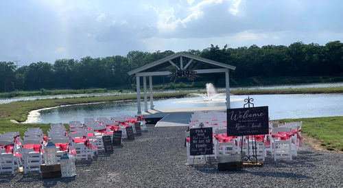 Lakeside ceremony seating facing the pavilion and fountain at Reverie at Diamond D