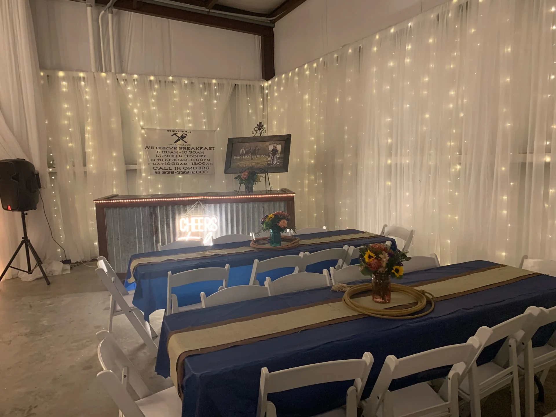 Guest tables and the rustic bar set for a private event at Reverie at Diamond D in Normangee, Texas