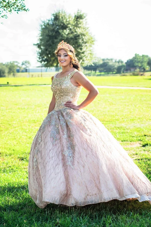 Sweet 16 portrait with a crown in the open field at Reverie at Diamond D