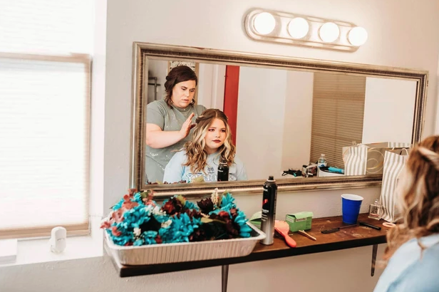 Hair styling in the bridal suite during a bachelorette weekend at Reverie at Diamond D