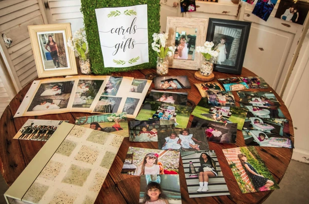 Cards and gifts spool table with framed photographs and guest book at Bryanna's Sweet 16