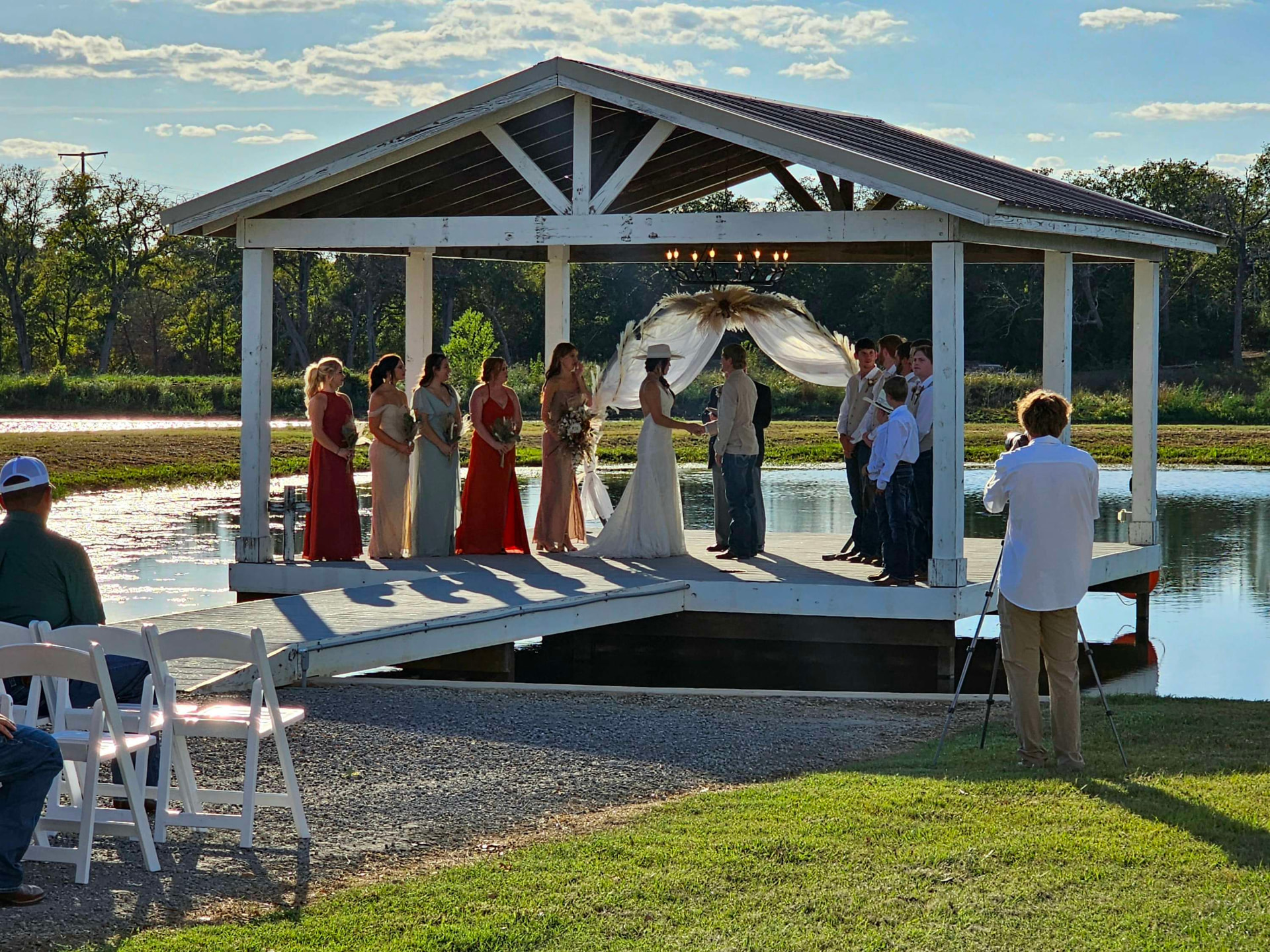 Ranch wedding ceremony beside the lake at Reverie at Diamond D