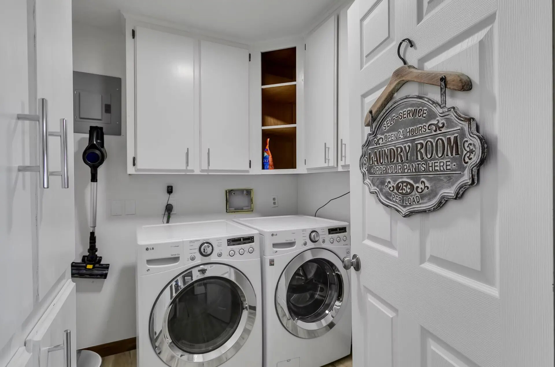 Farmhouse laundry room with full-size washer and dryer at Reverie at Diamond D