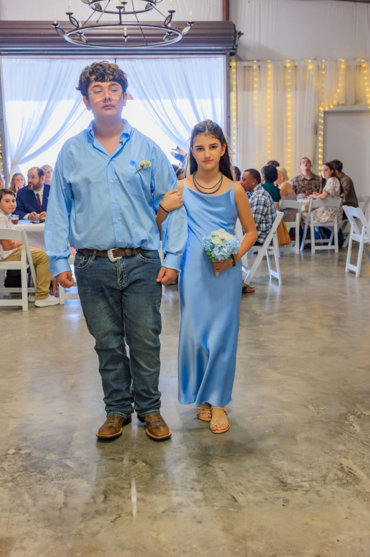 Jaelyn & Keelan's wedding at Reverie at Diamond D — junior attendants walking down the aisle during the wedding party entrance