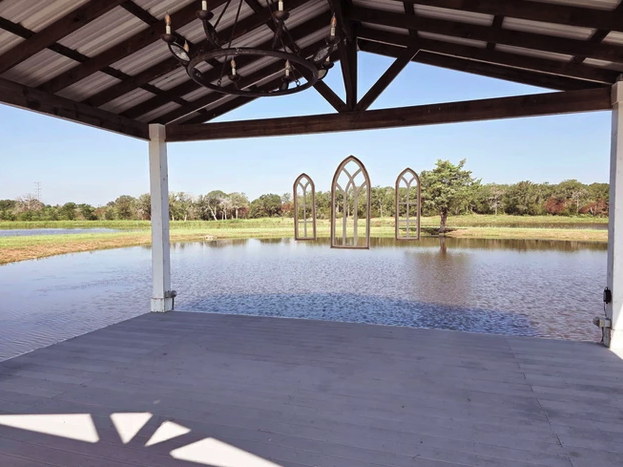 Covered lakeside ceremony pavilion at Reverie at Diamond D, a wedding venue near College Station, Texas